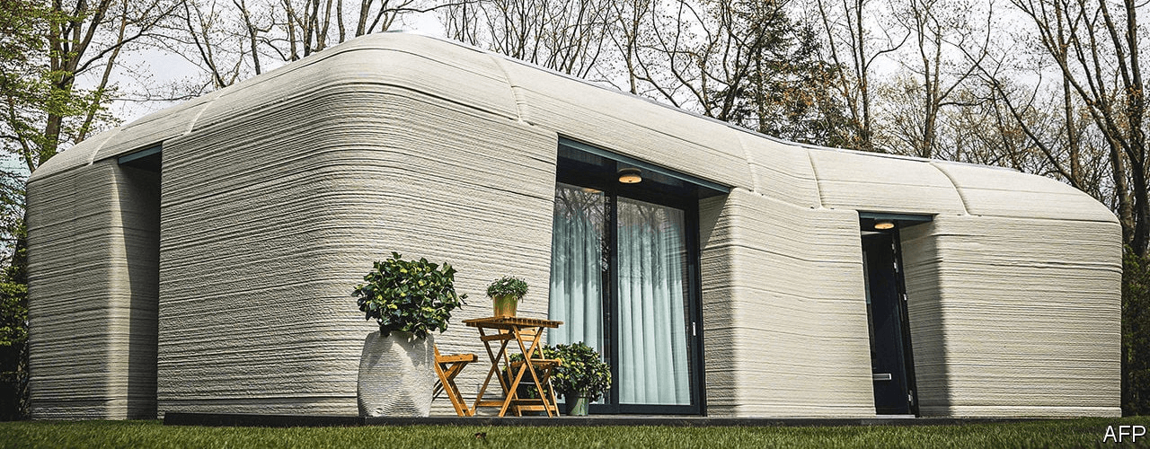 Photo of a 3D printed concrete house.